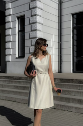 a lady wears a white mini vest dress